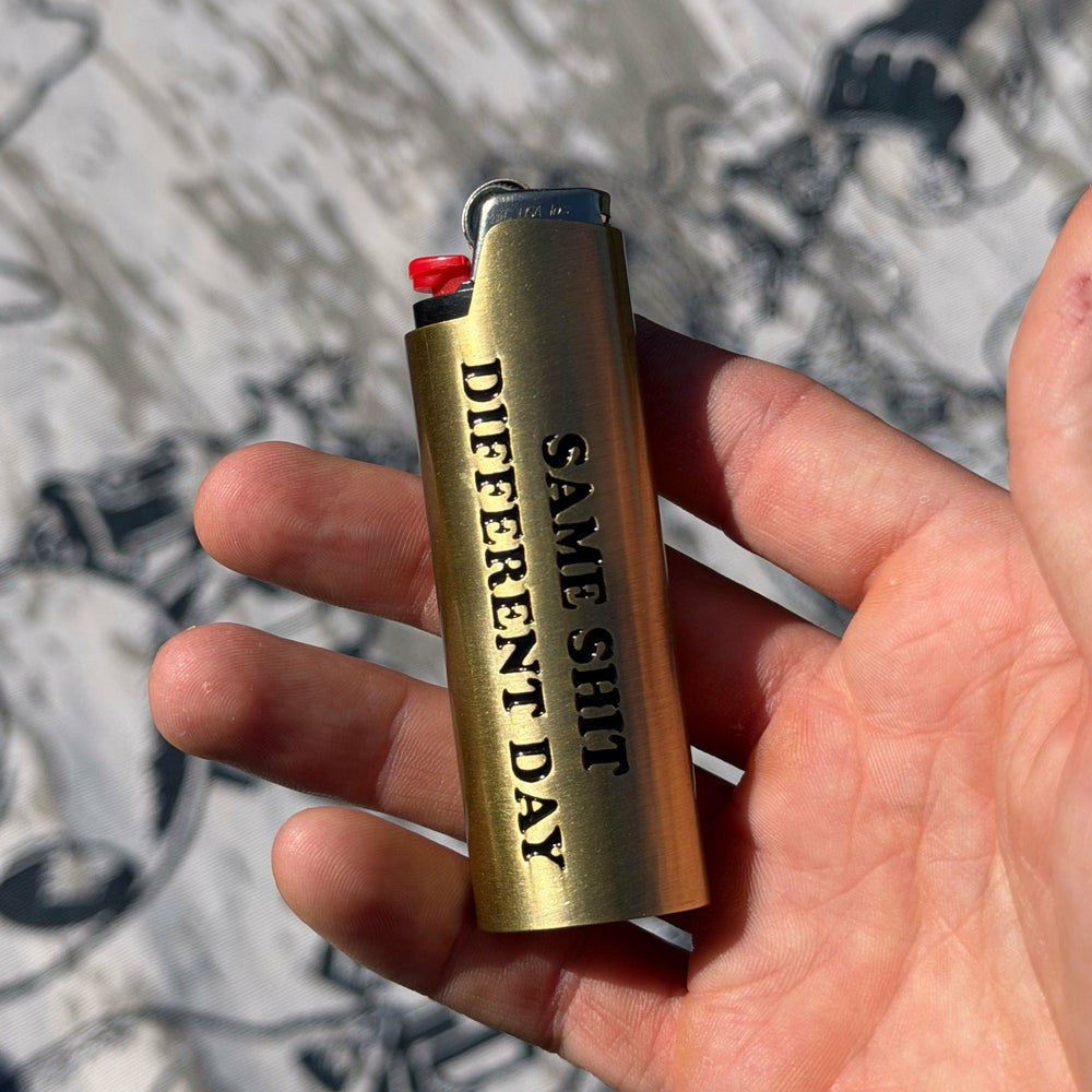 Ripndip New | Same Shit Different Day Lighter Cover (Gold)
